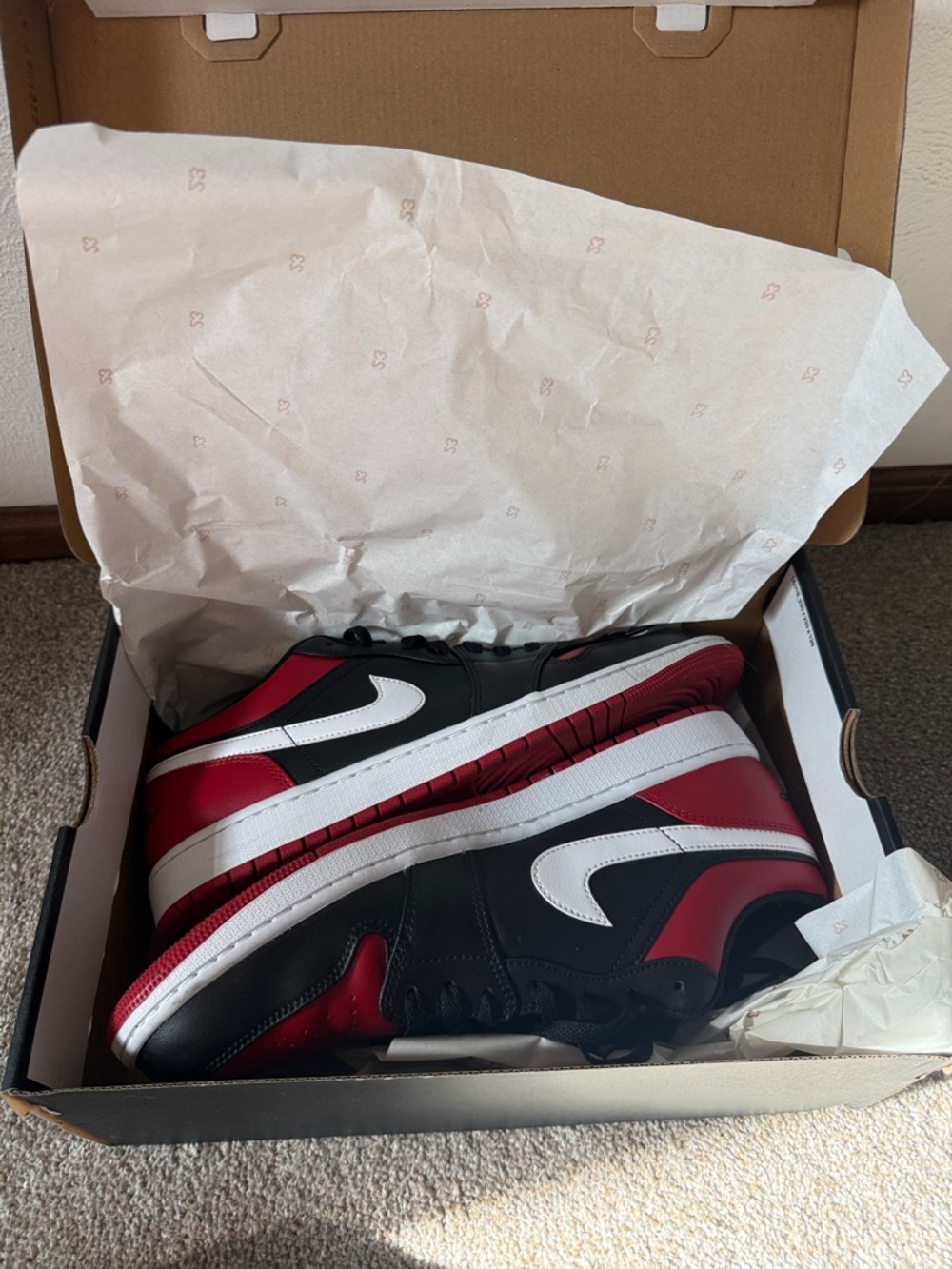 Jordan 1 Low Nike Men’s Black and Red Low-Top Sneakers with White Swoosh